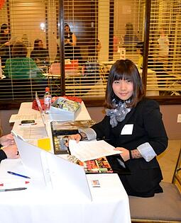 Li Xiong, from China, is our MBA student. Here she is preparing to speaking with a top fashion company at our career fair.